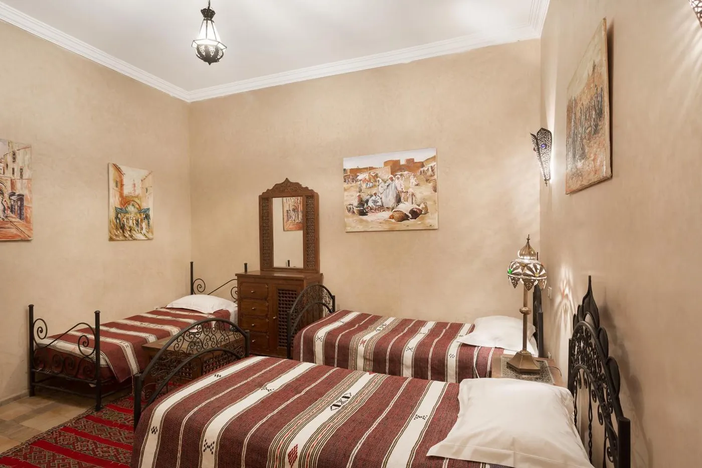Twin beds with striped Berber blankets