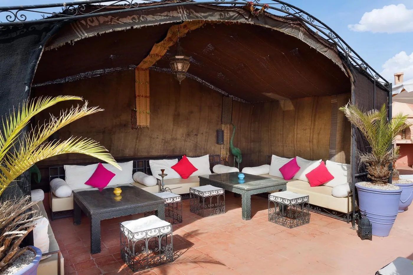 The Berber tent lounge on the rooftop terrace, cushions in the sun
