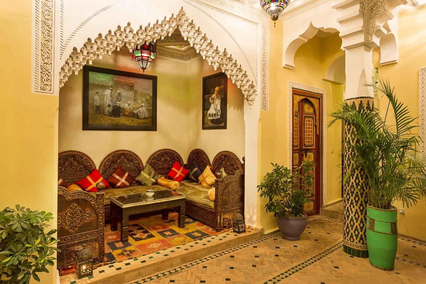 A seating corner with Moroccan rugs and paintings